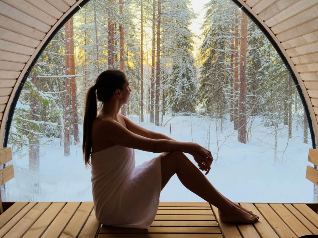 Timber-lined panoramic sauna with a view to the forest